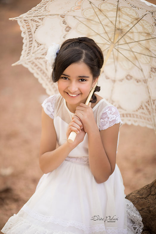 Girl sitting with white umbrella