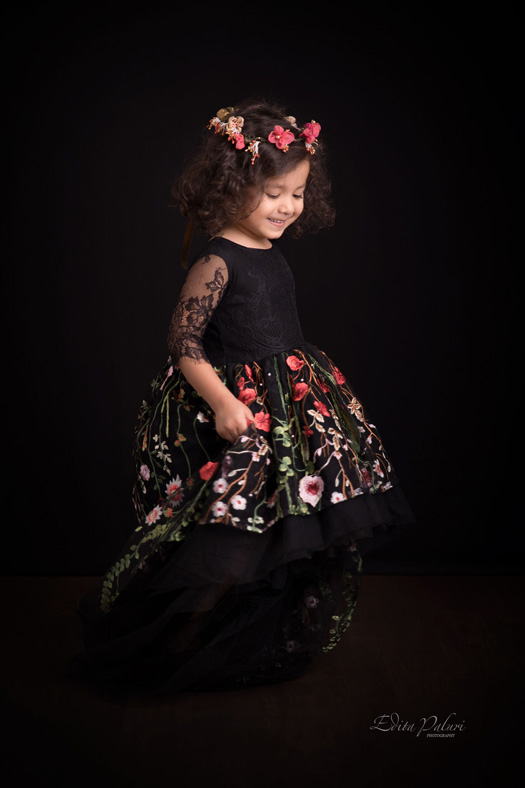 4 year old beautiful girl in black floral dress