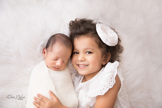 siblings - big sister and newborn brother