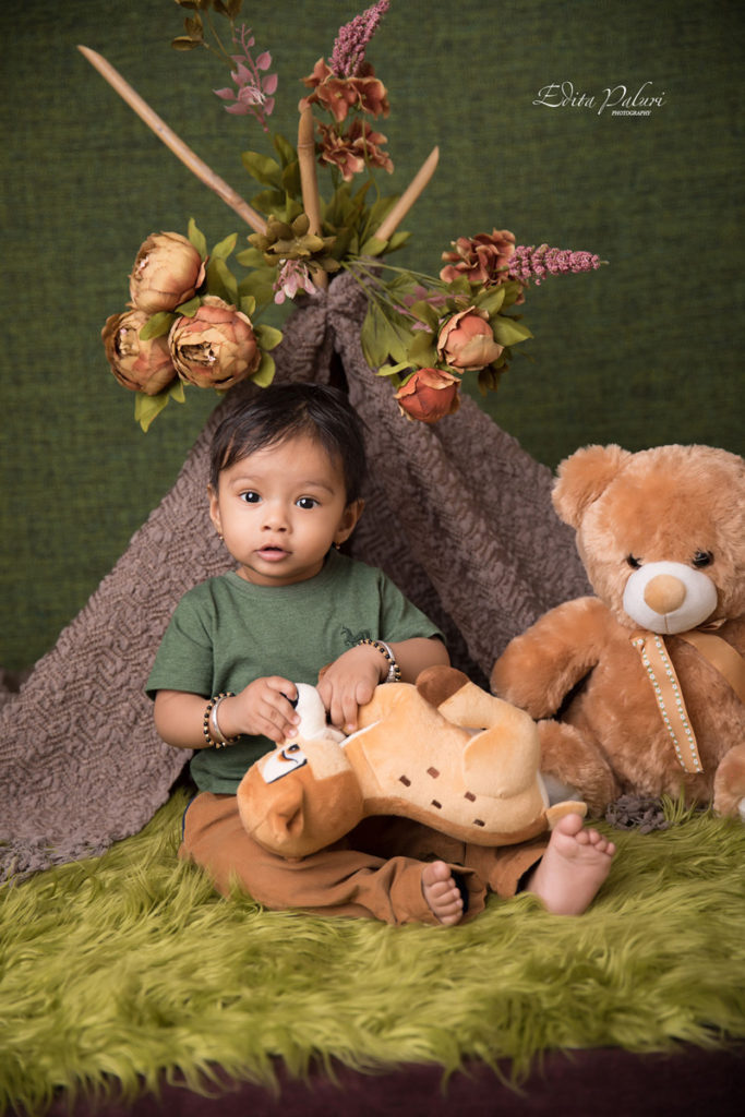 Surprised 10 months baby boy pictures near teepee