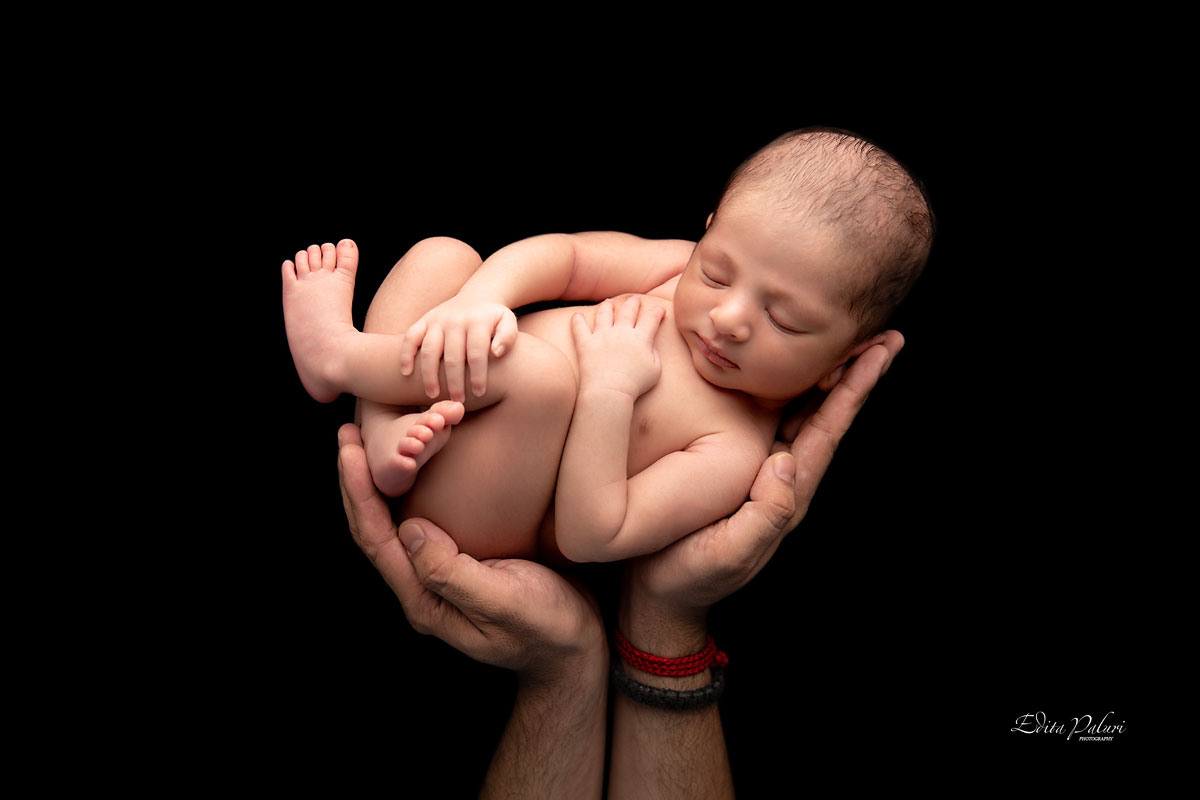 newborn in father hands