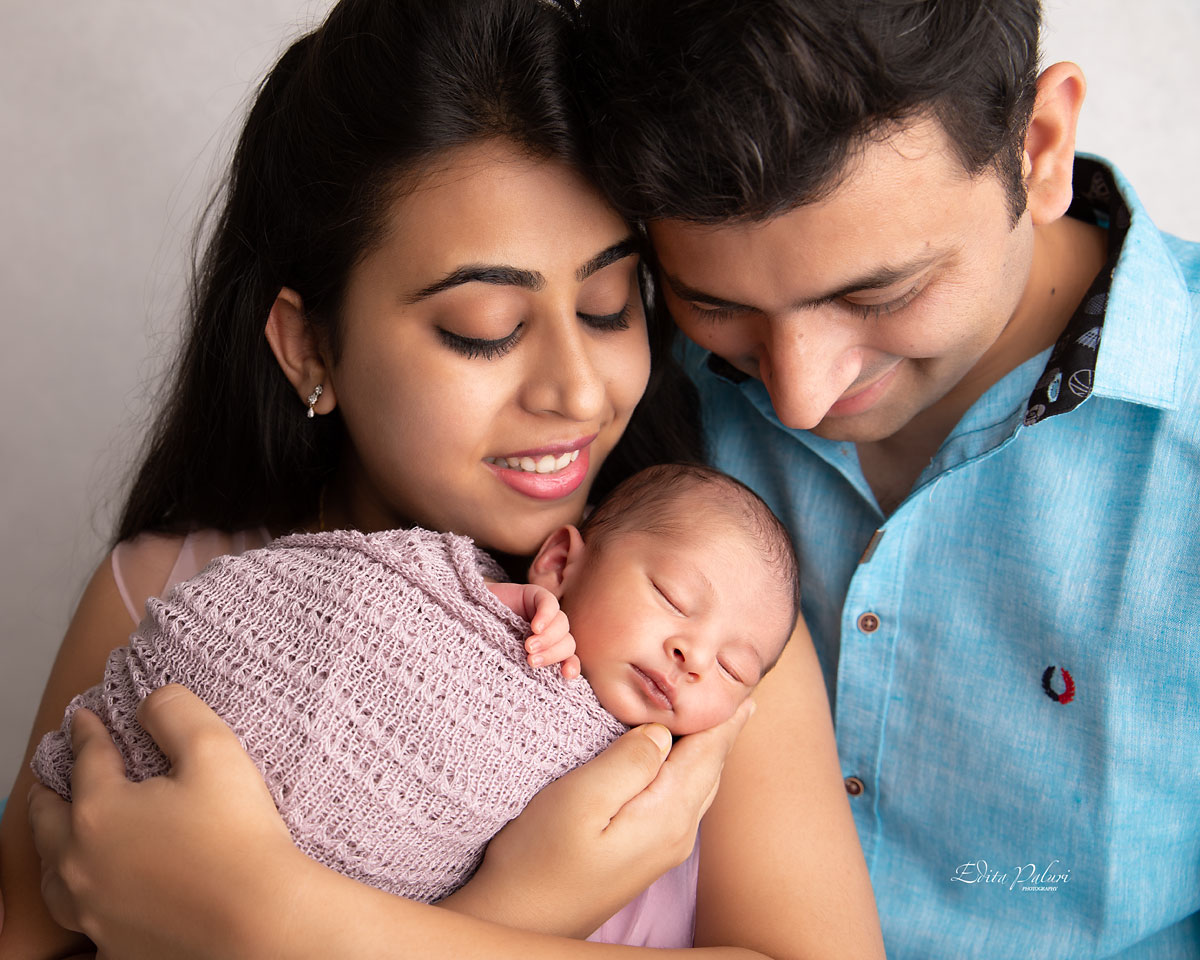 loving parents and newborn photo Pune