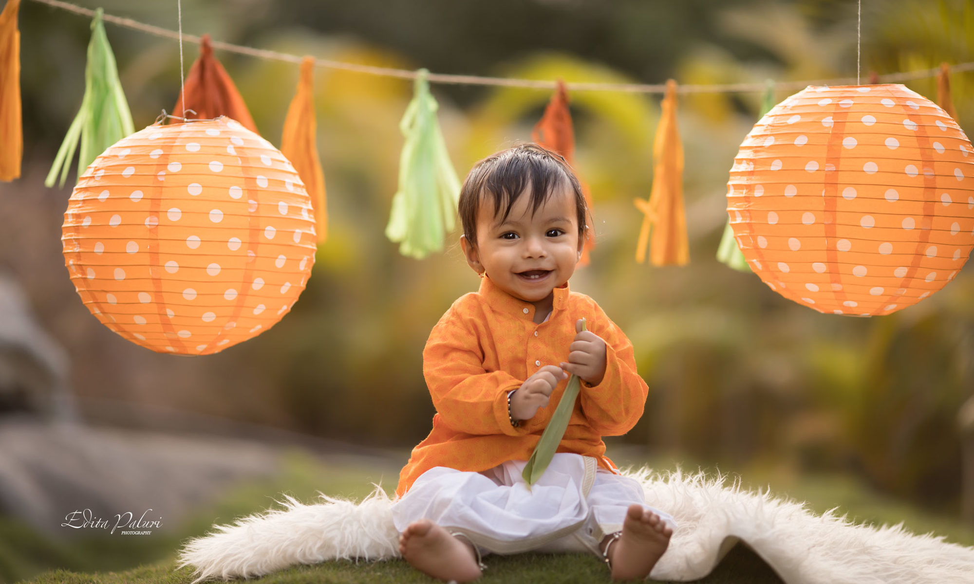 Indian baby boy in orange traditional attire