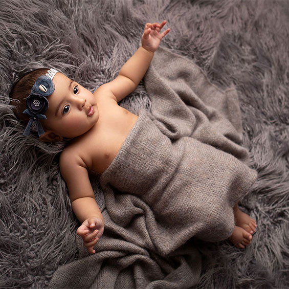 5 month baby girl in grey neutral color