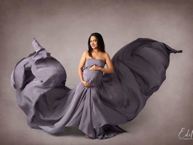 Maternity fabric tossing photography at specialized photo studio in Pune