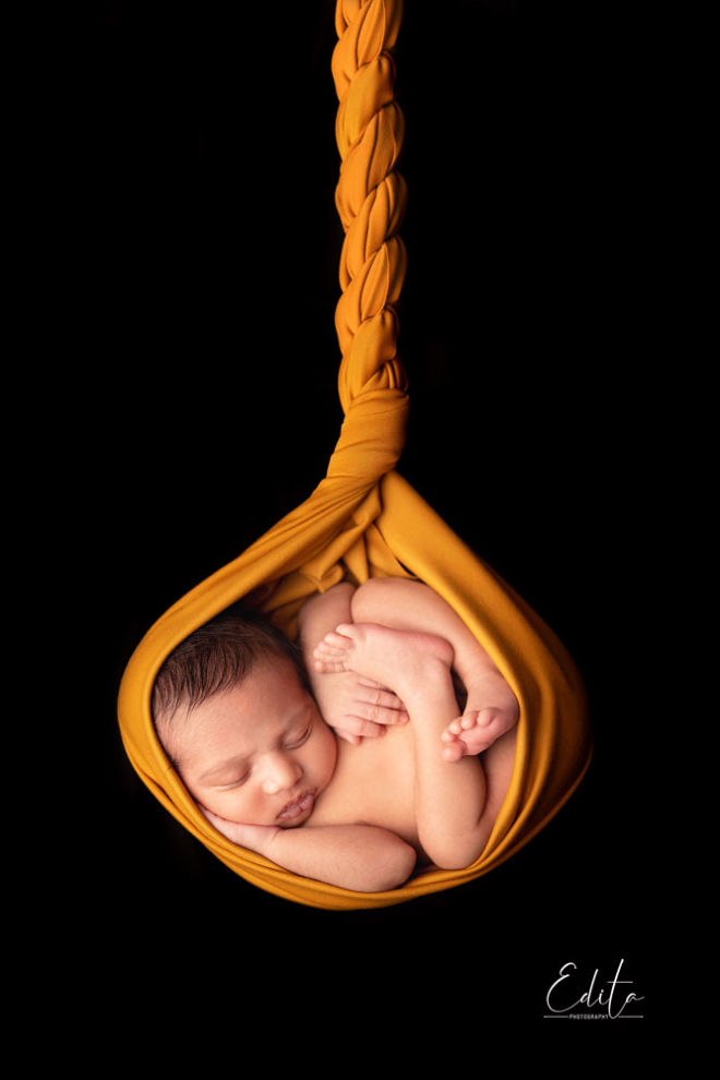 baby boy hanging in cocoon shaped wrap photoshoot in pune