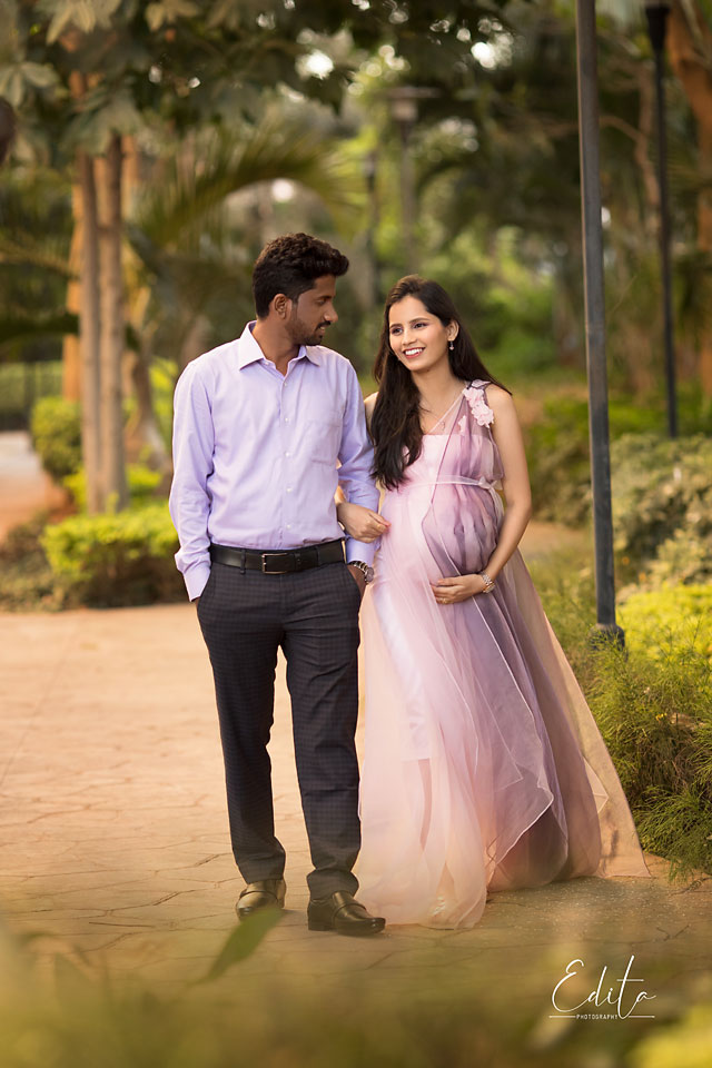 Couple walking in garden maternity photography in Pune