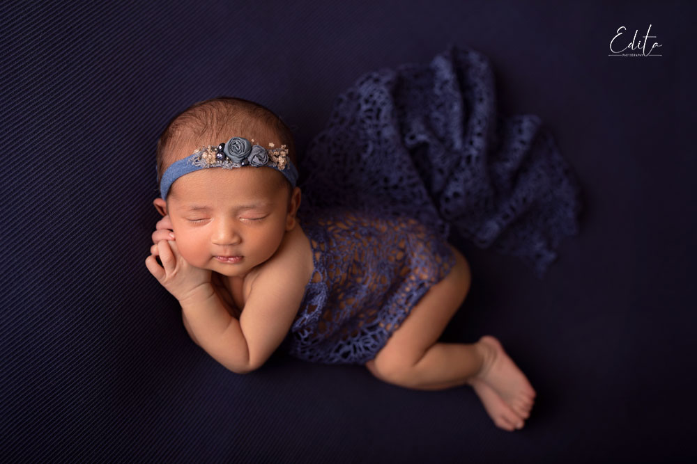 13 days newborn baby girl in blue. 