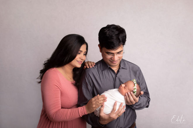 Newborn baby photo with family