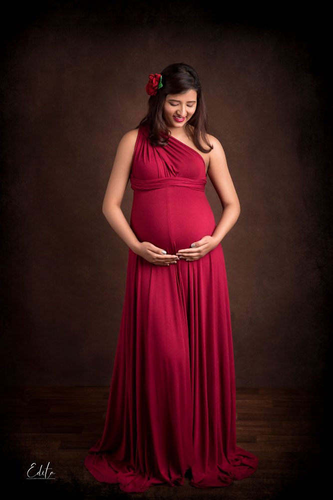 Pregnancy photography - mom to be in maroon transformer gown