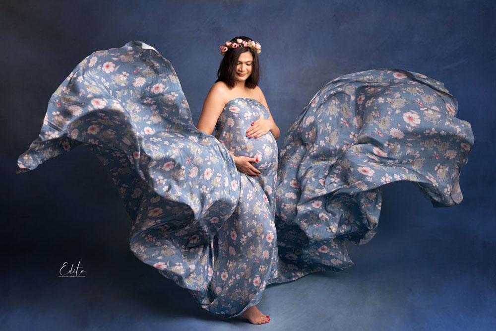 Floral blue fabric toss pregnancy photos Pune