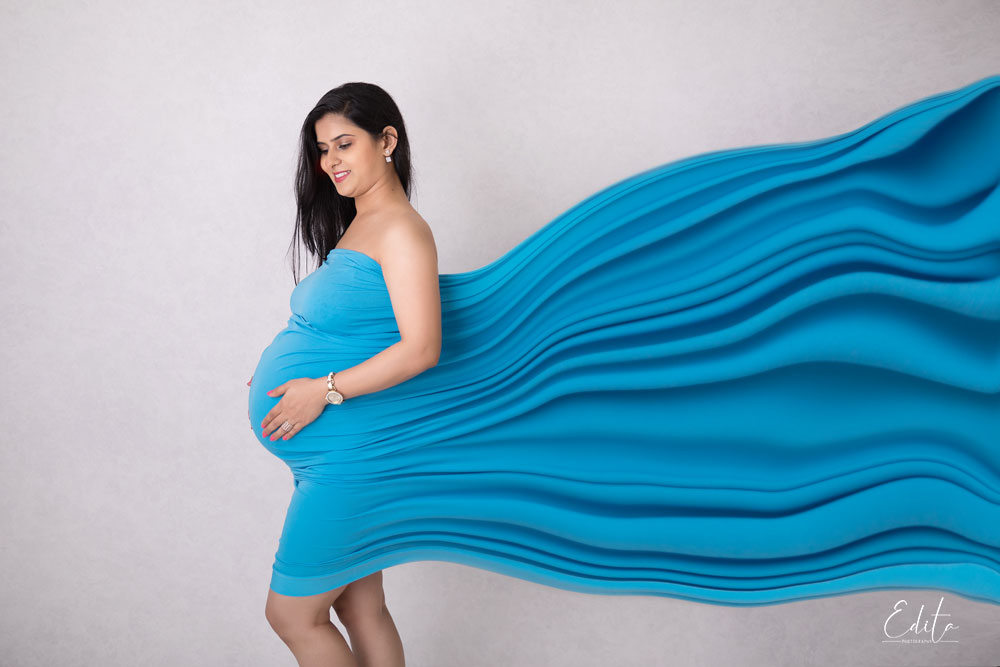 Blue fabric wrap at studio for motherhood photography