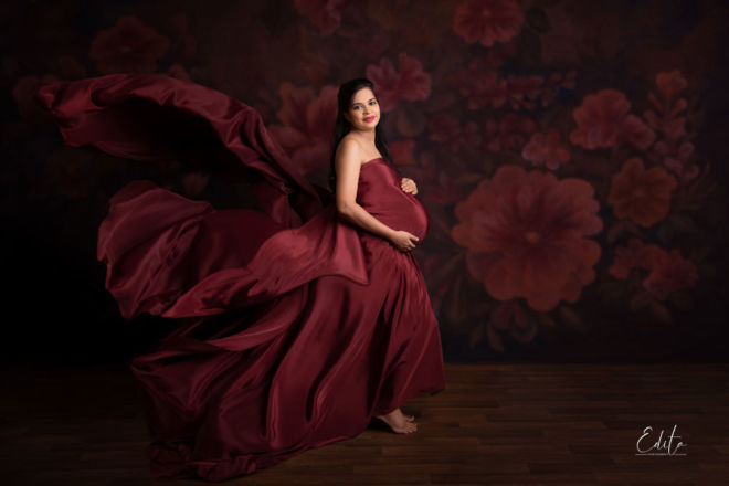 Maroon satin fabric tossing maternity photo