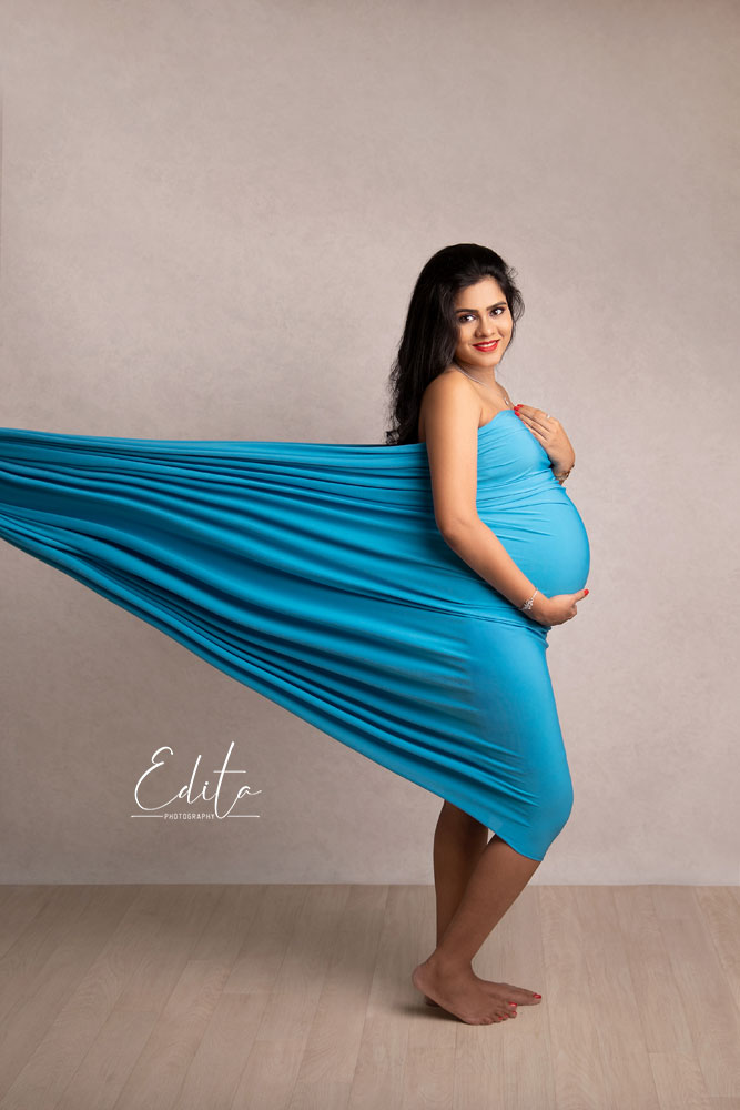 Light blue fabric toss in naternity photo sessions in Pune