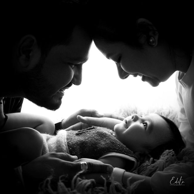 4 month baby boy with parent silhouette photo