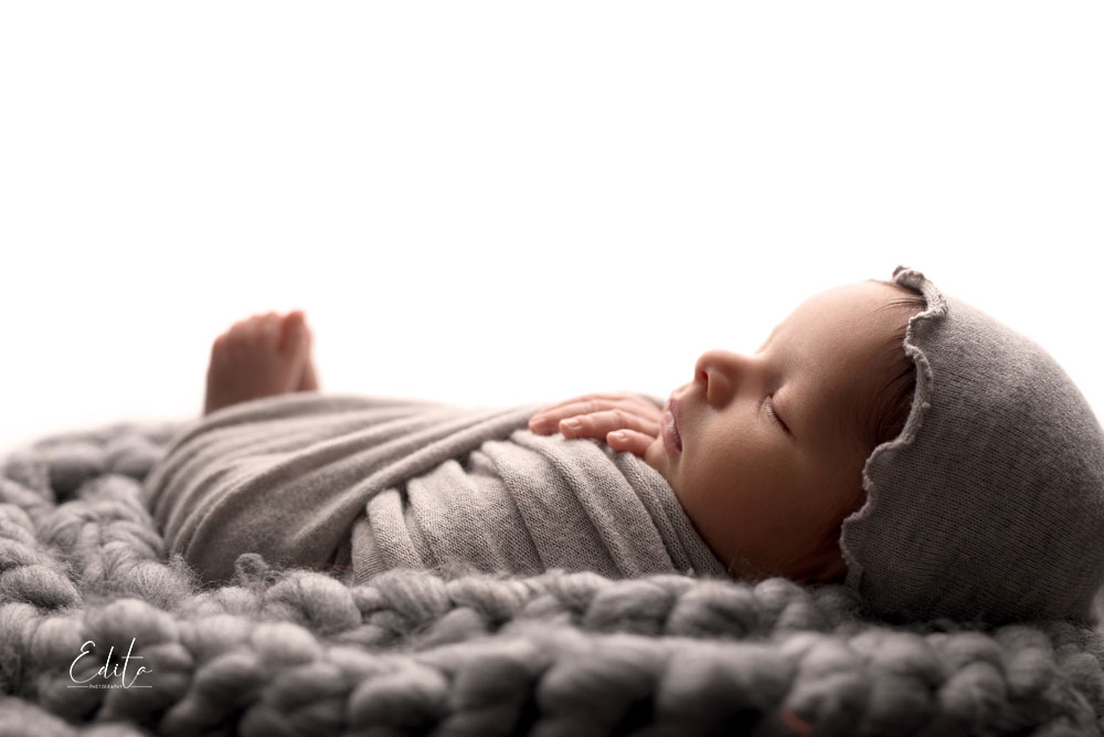 Backlit newborn baby boy photo in Pune