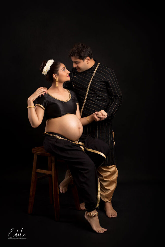 Indian couple maternity photo in traditional wear